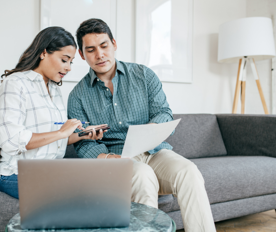 Family Services Image of couple looking and preparing their family taxes